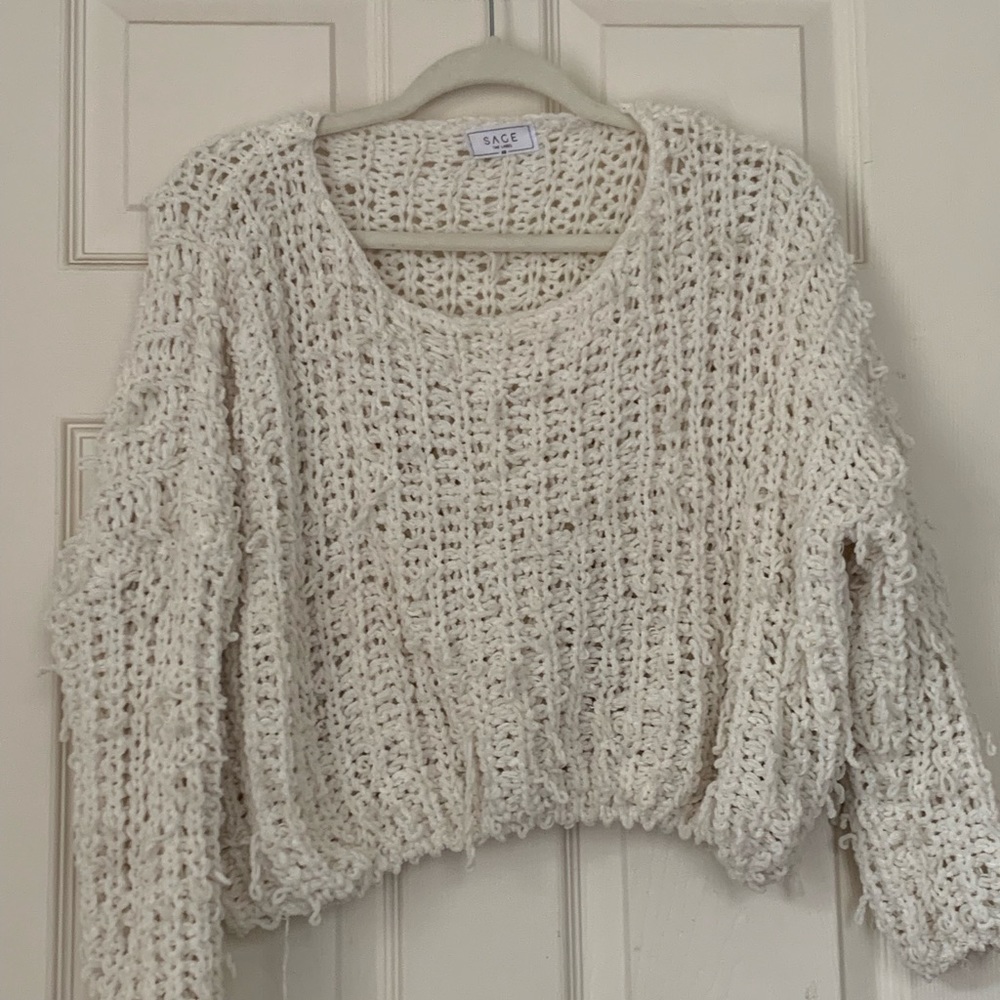 Distressed white sweater